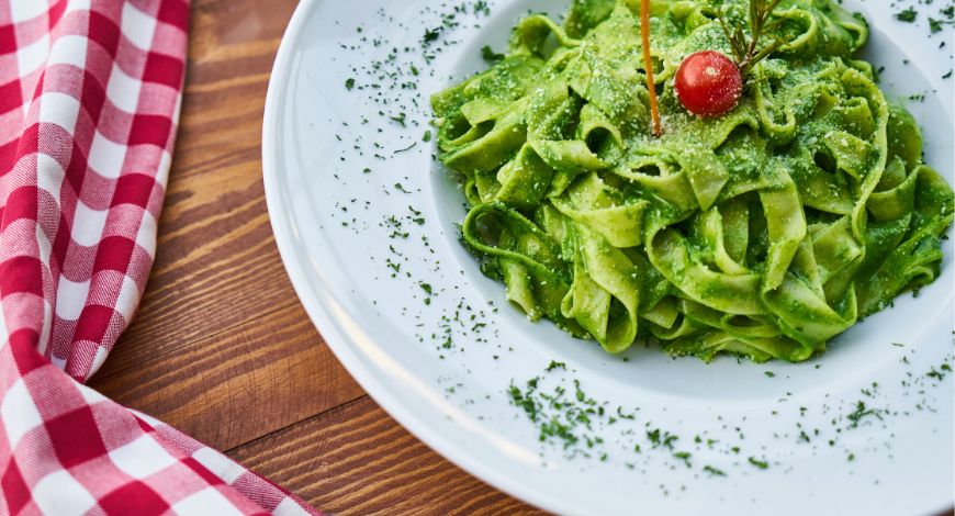 plate-filled-with-pasta-with-pistachio-butter-topping